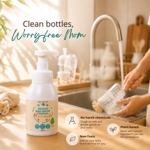 Clean Earth Natural Baby Bottle Cleanser pump bottle on a kitchen counter near a person washing a bottle at the sink, with overlay text reading "Clean bottles, Worry-free Mom" and highlighting no harsh chemicals, non-toxic, and plant-based benefits.