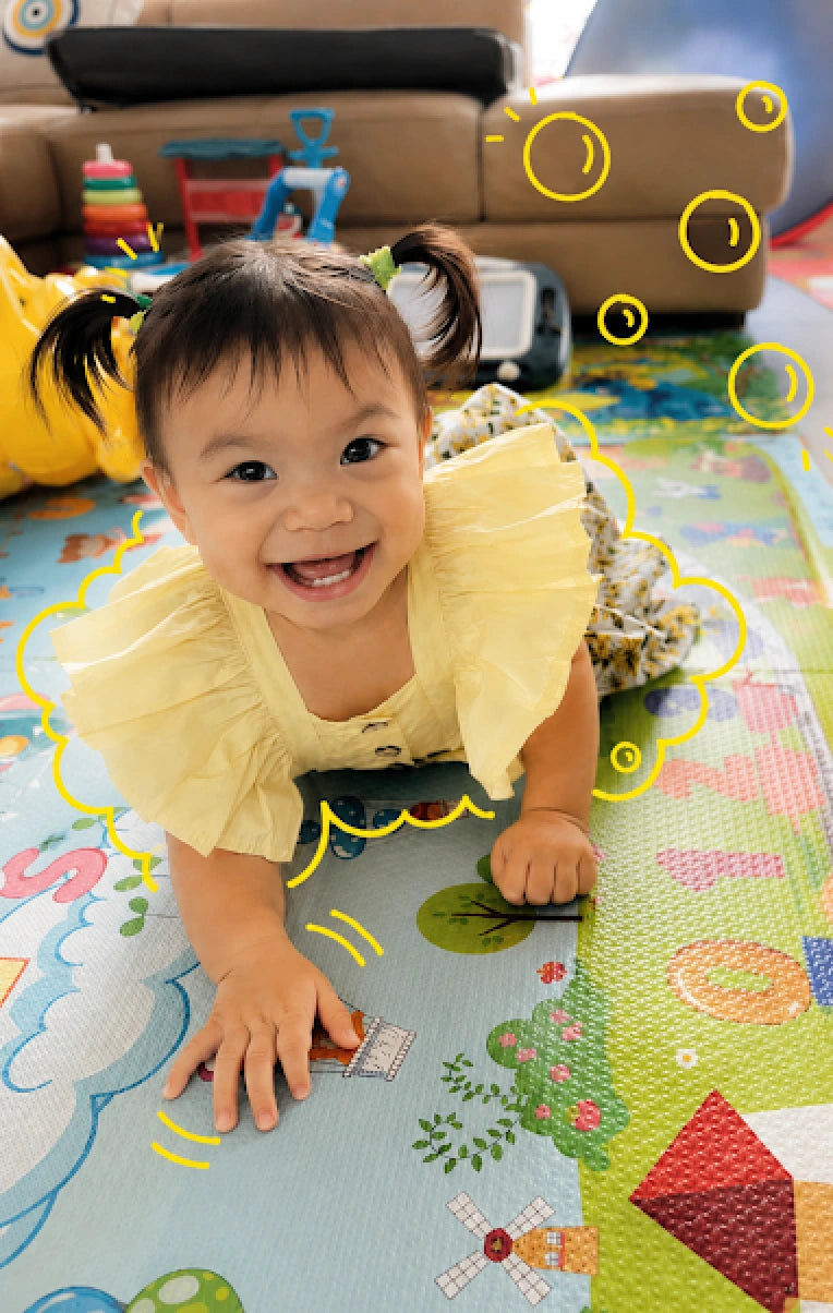 Happy baby playing safely on a mat cleaned with Clean Earth baby-safe non-toxic cleaning products