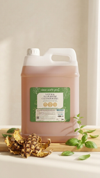 Clean Earth 10L natural all purpose cleaner bulk refill jug on a kitchen counter with fresh basil and pineapple peels