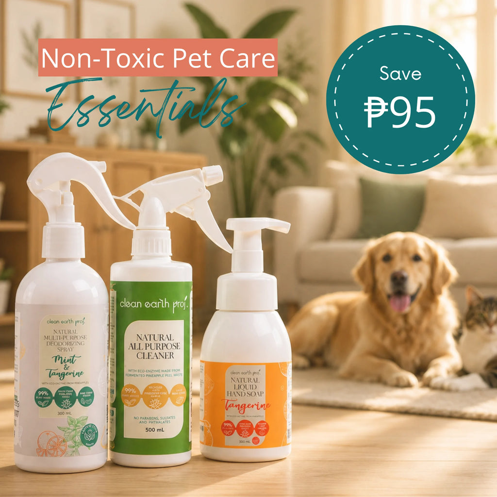 Three Clean Earth eco-friendly cleaning products—Mint & Tangerine Deodorizing Spray, Holy Basil All-Purpose Cleaner, and Tangerine Liquid Hand Soap—displayed on a table with a dog resting in the background and text reading "Non-Toxic Pet Care Essentials"