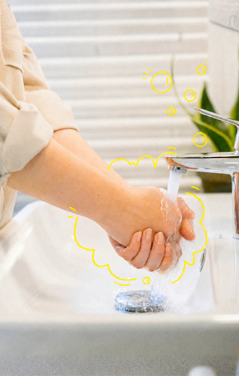 Person washing hands with Clean Earth natural foaming liquid hand soap designed for sensitive skin